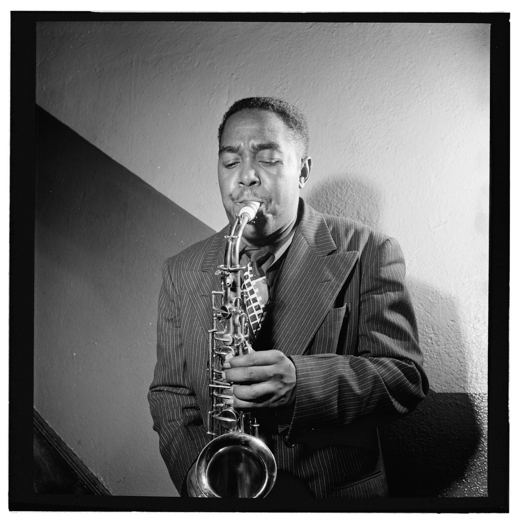 black and white photo of charlie parker with his saxiphone