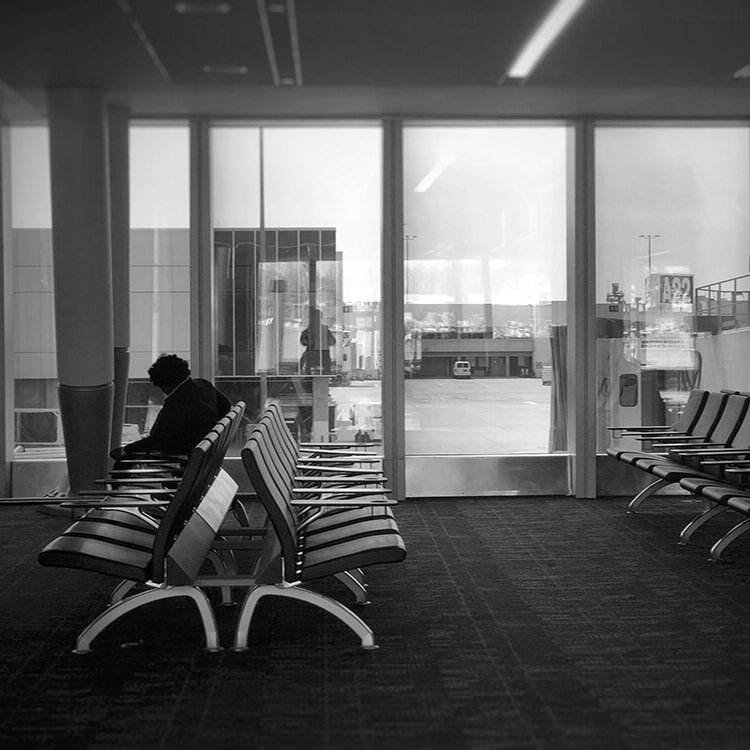 a black and white empty airport seating