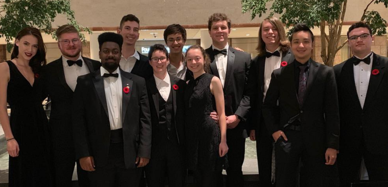 group of orchestra students dressed in formal attire