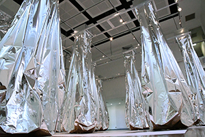 exhibit of hanging silver forms that inflate with contact