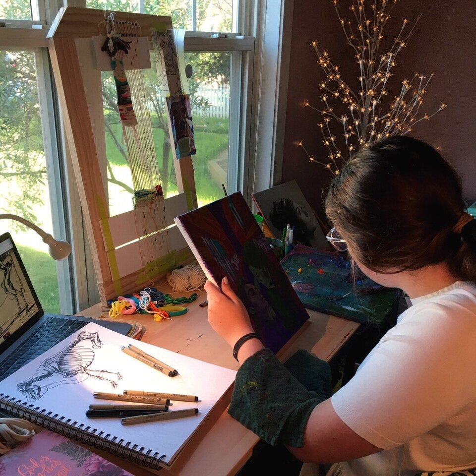 student drawing at home