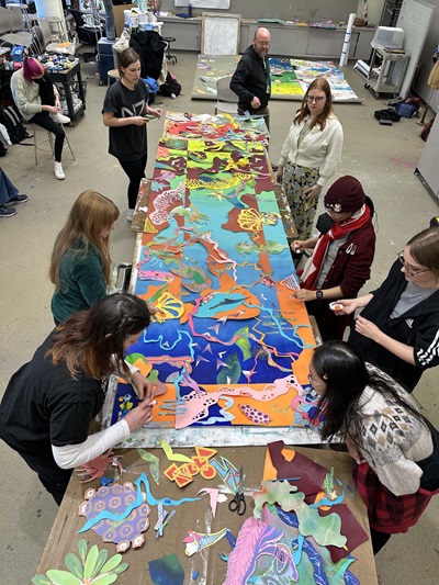 students working on mural