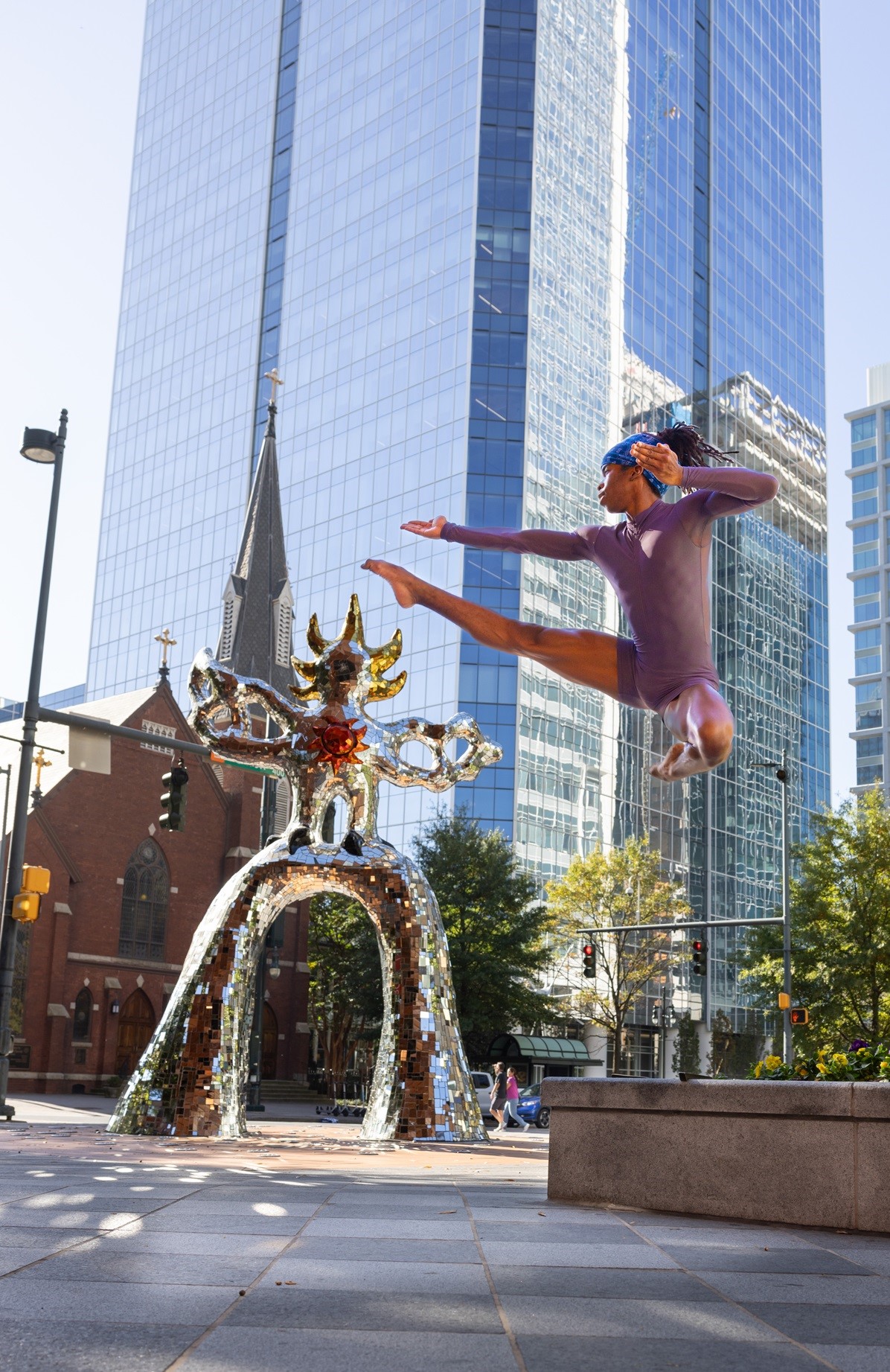 Alabi Orisedele leaping in downtown Charlotte