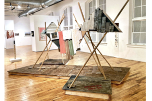 display of art- poles and triangle sculpture