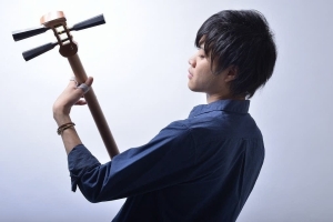 Japanese musician playing the shamisen