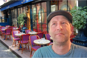 David Fillmore in virtual cafe setting onscreen