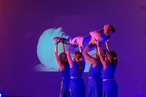 dance students holding mummy aloft