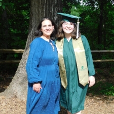 Jennifer outside with her mother in her cap and gown