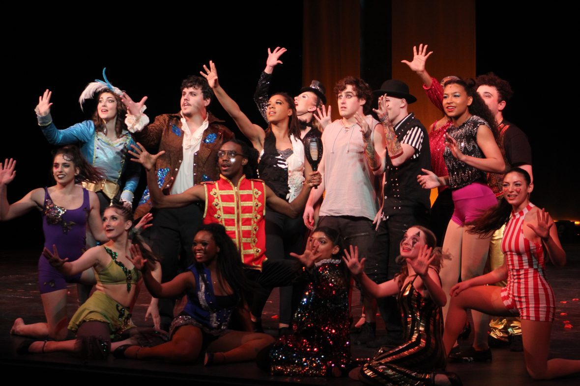 Group photo from Pippin with everyone in jazz hands