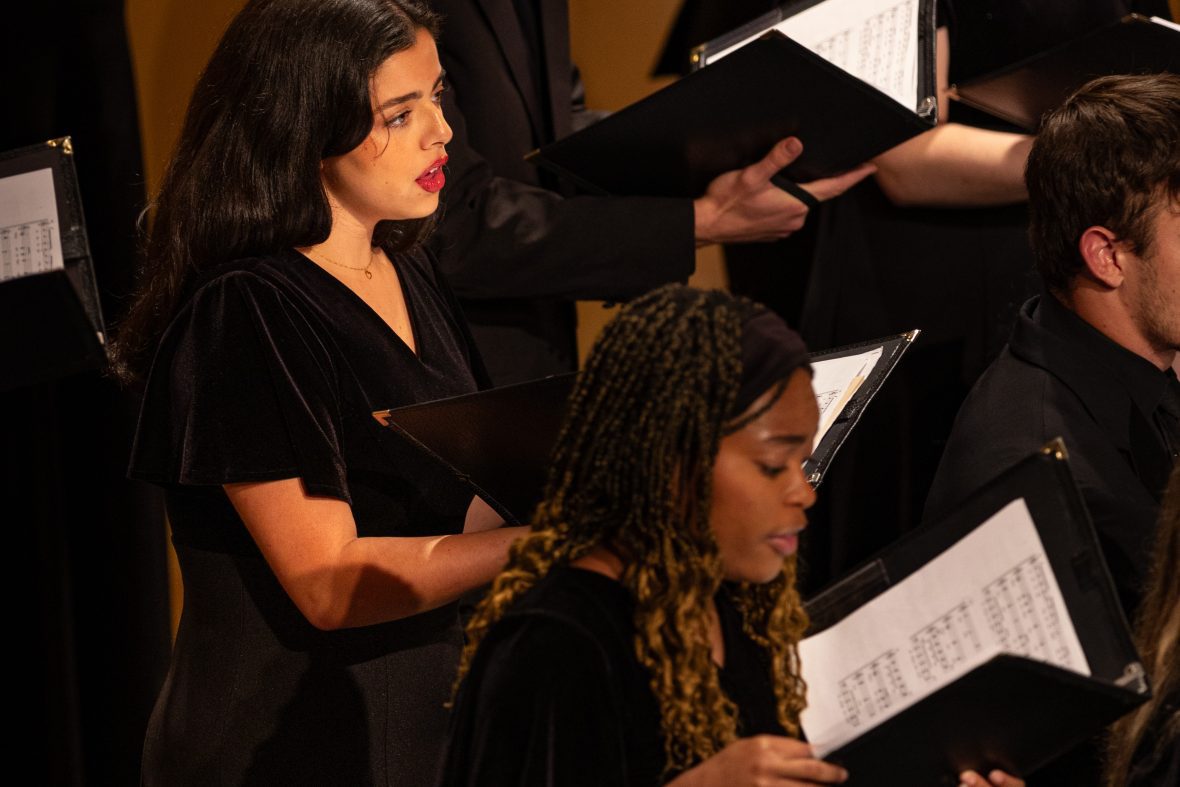 Choral students on stage, singing