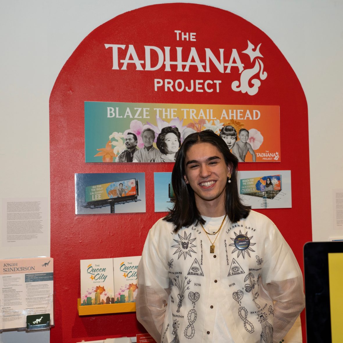 Art students standing in front of his final project in the gallery