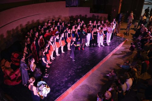 large group of dance students on stage