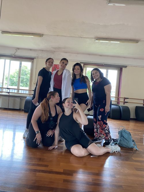 Selfie of a group of dance students in the studio through the mirror