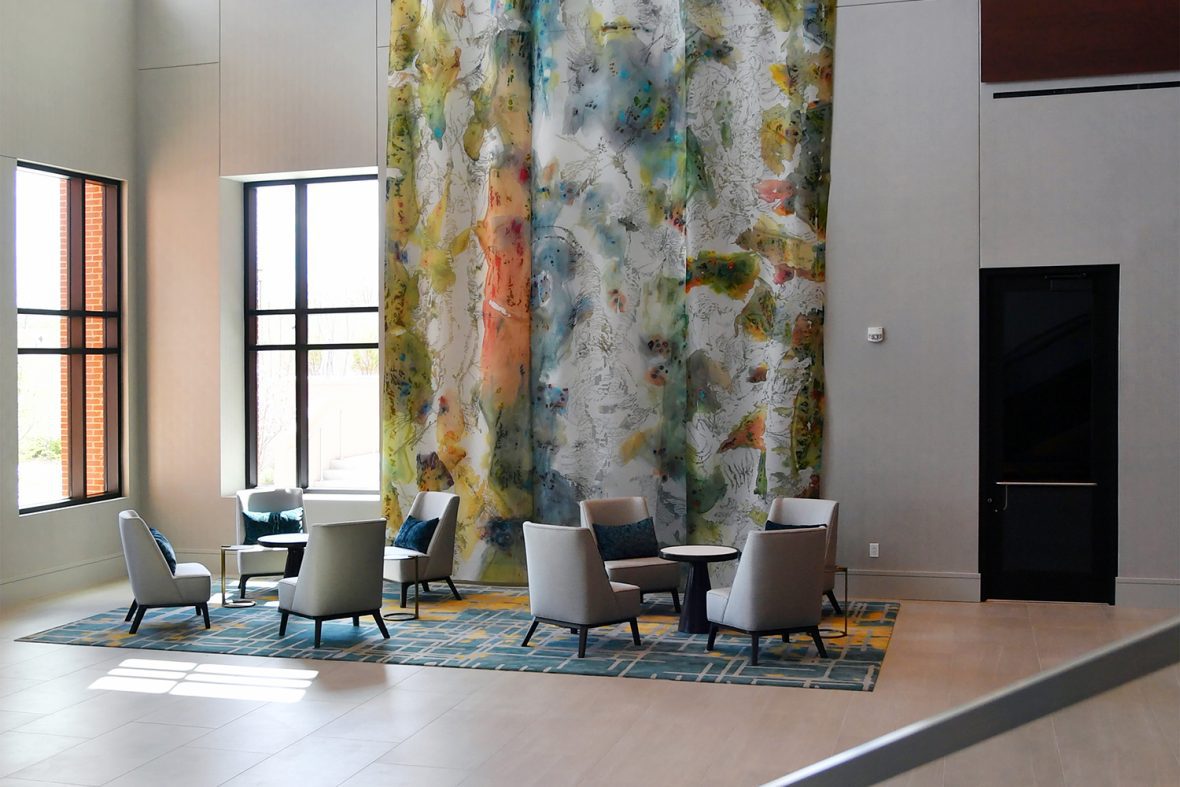 seating in a hotel with art on the wall