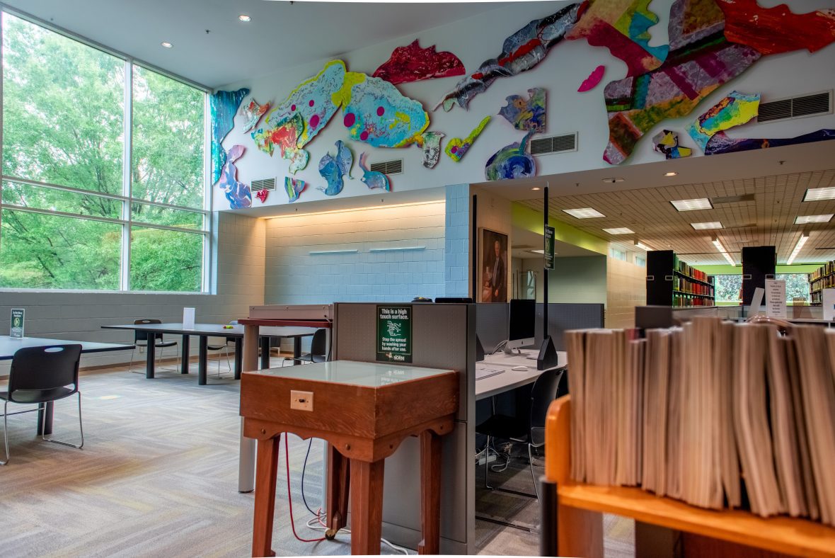 Hight Library with books in front and art on the walls