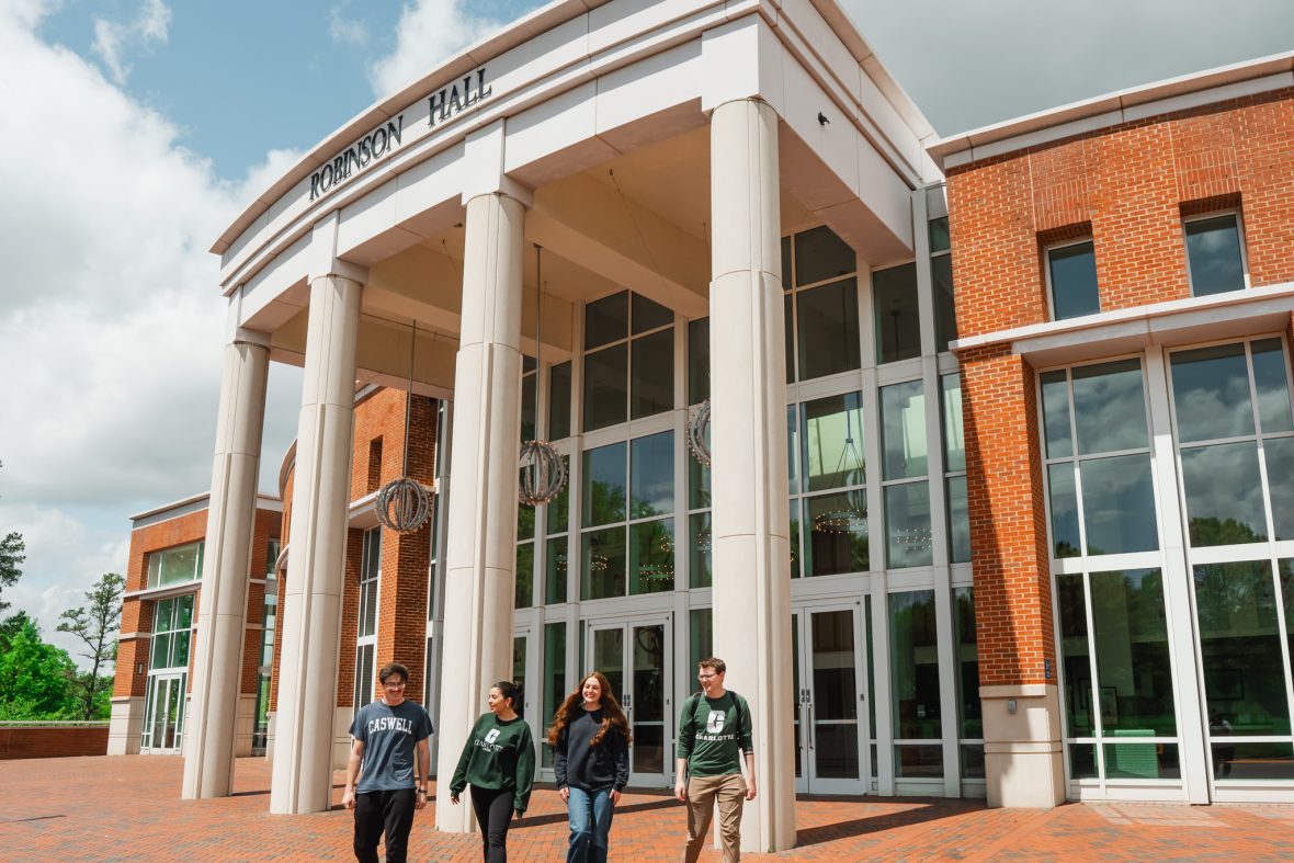 front of Robinson Hall with students walking out of it