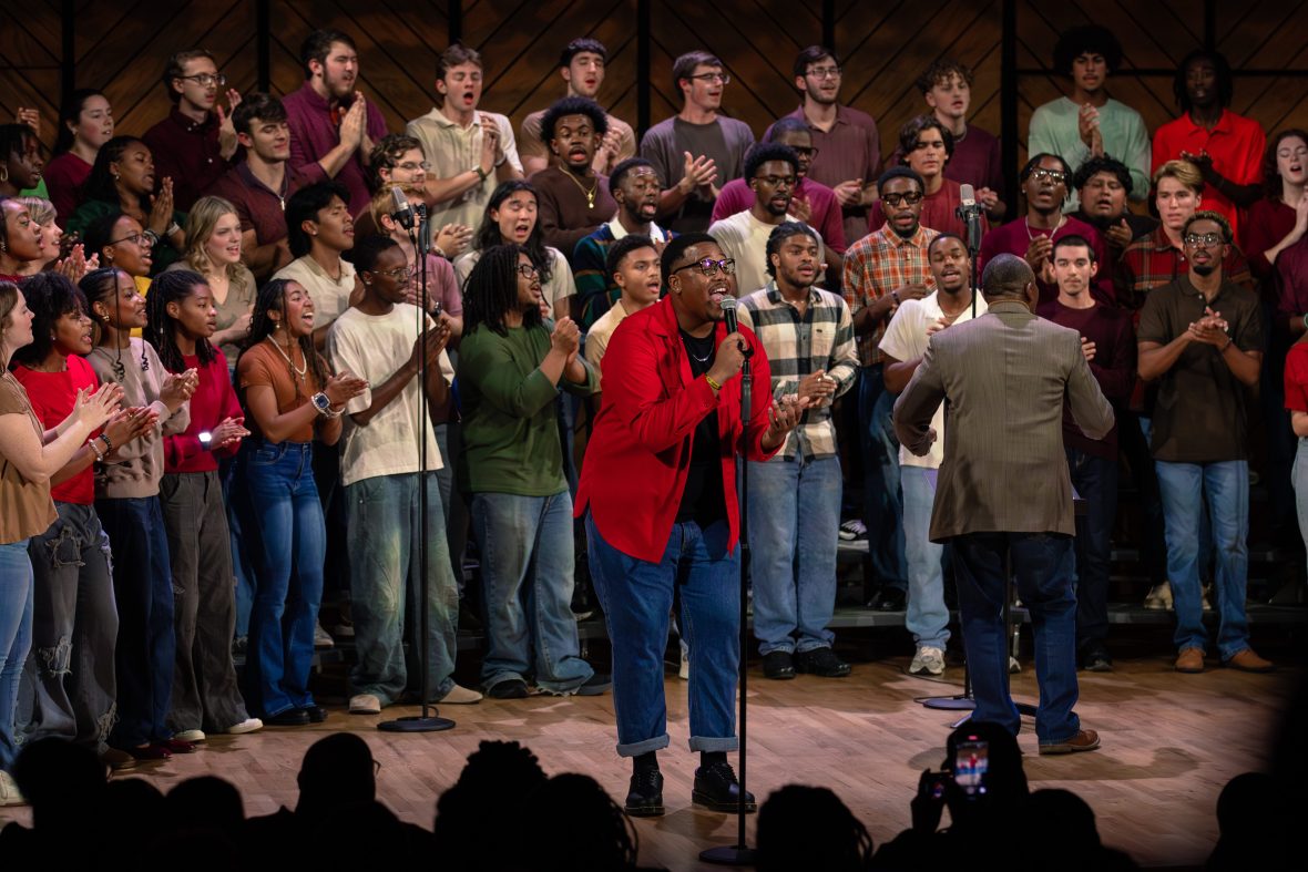 Gospel Choir singing, soloist in red shirt with mic