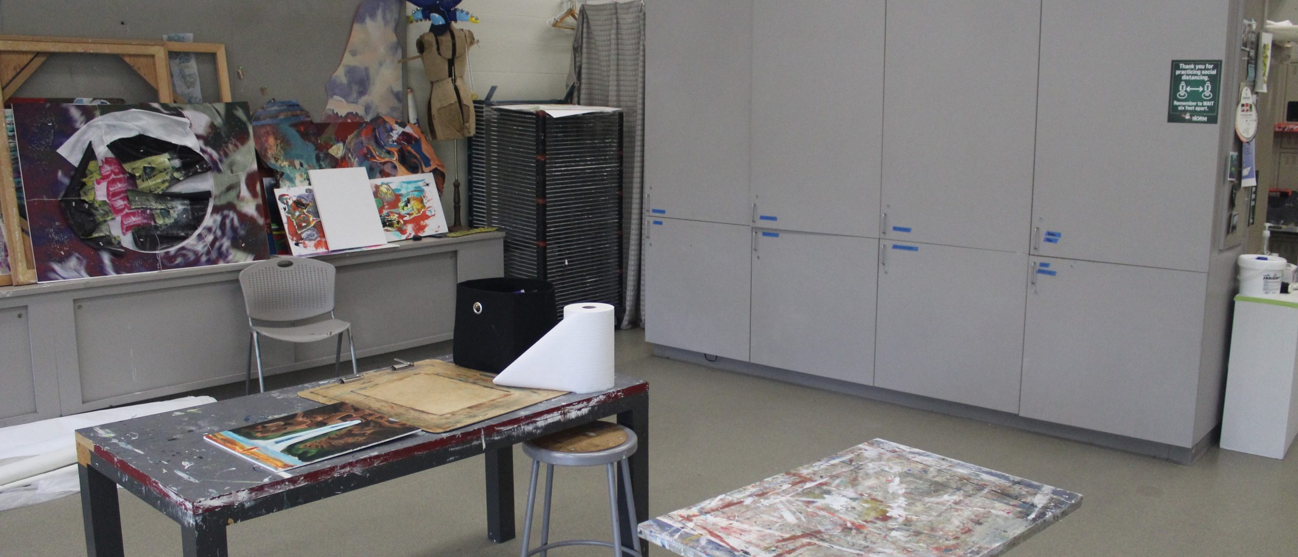 View of cabinets and paintings and tables