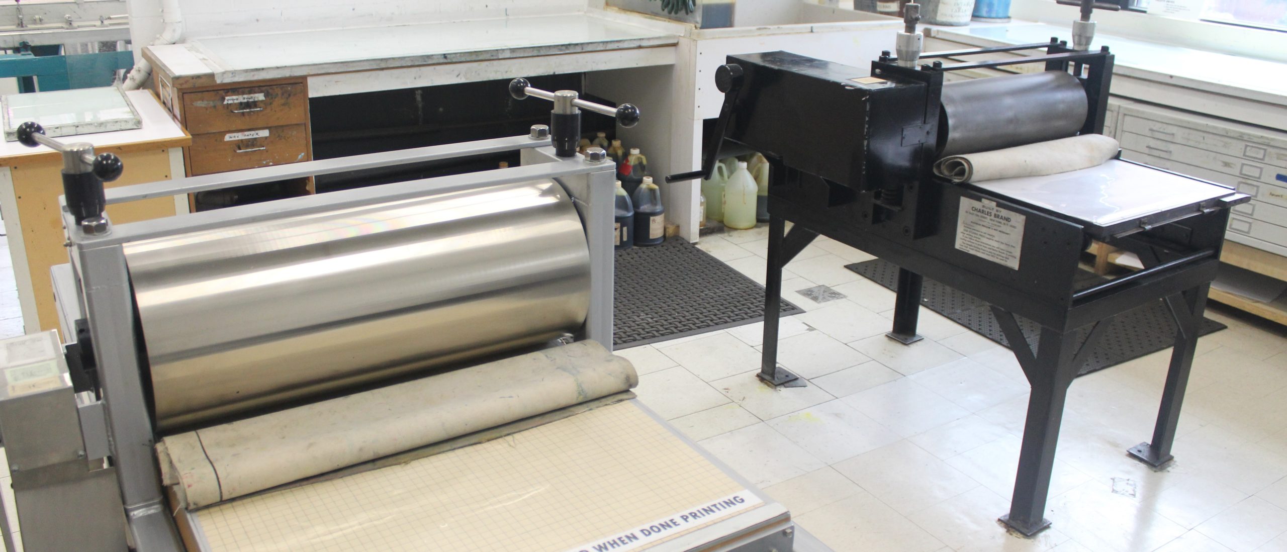 Close-up view of printmaking machinery