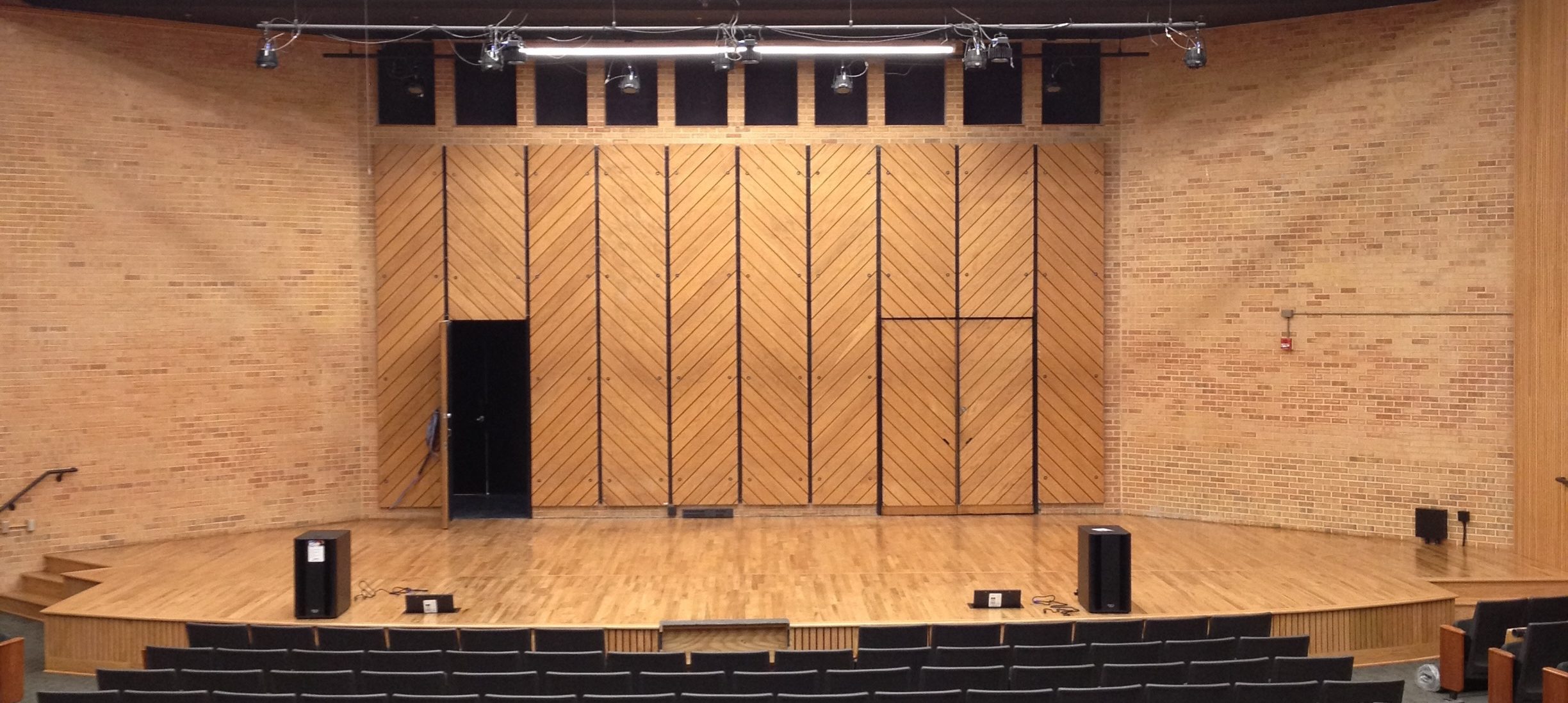 Empty Rowe recital hall stage with seats