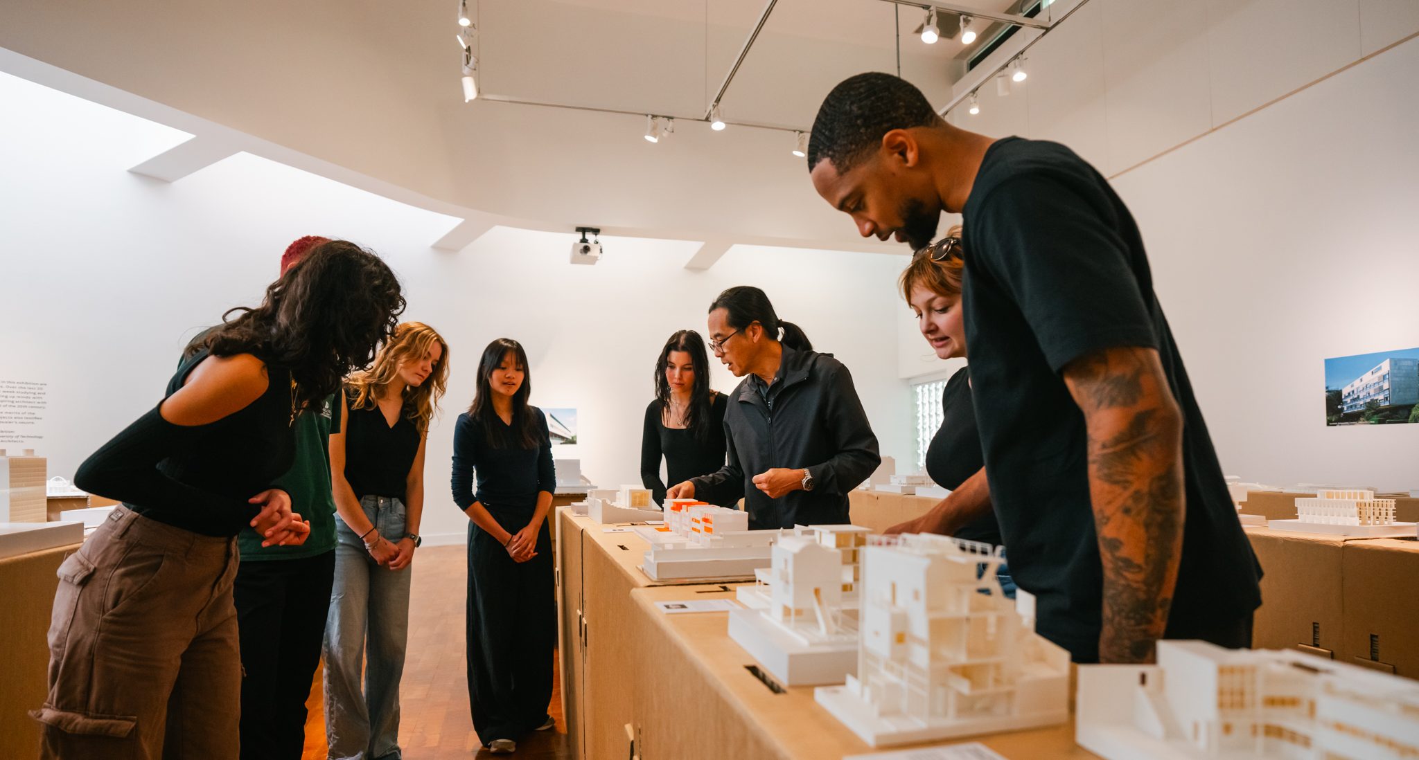students looking at models in a gallery 