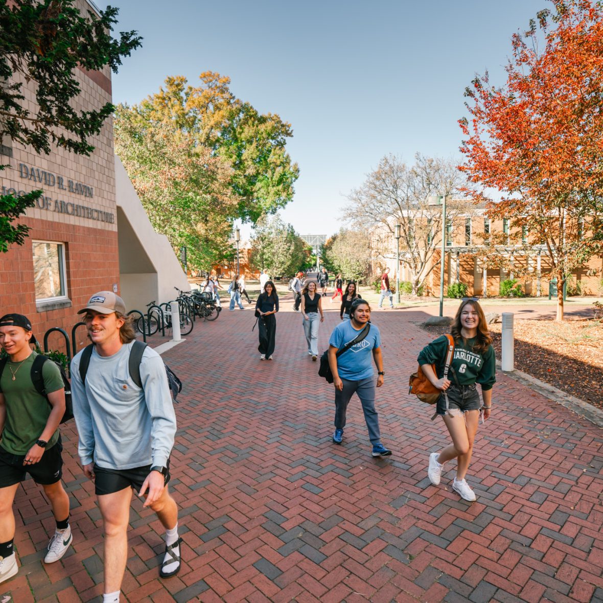 students walking into the Storrs building on a fall day