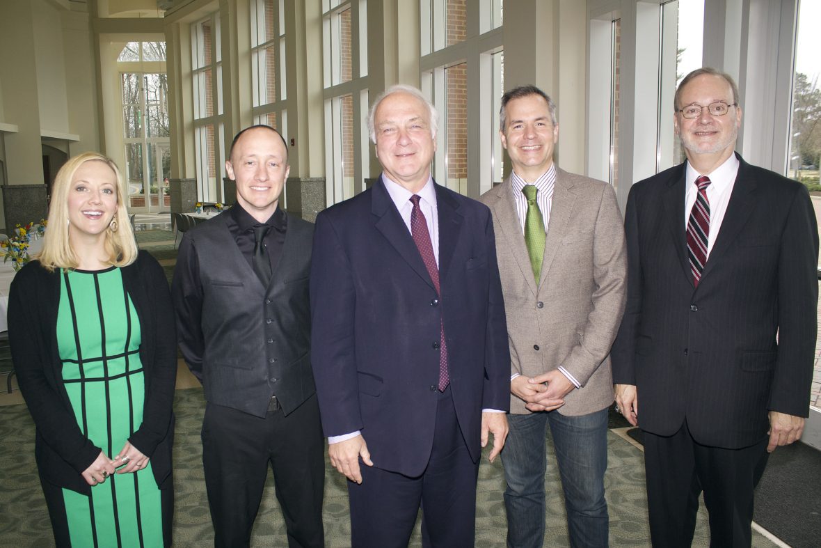 2015 alumni standing in the lobby of Robinson Hall