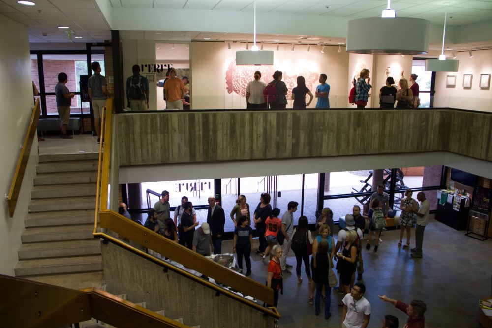 Inside rowe lobby with people standing around