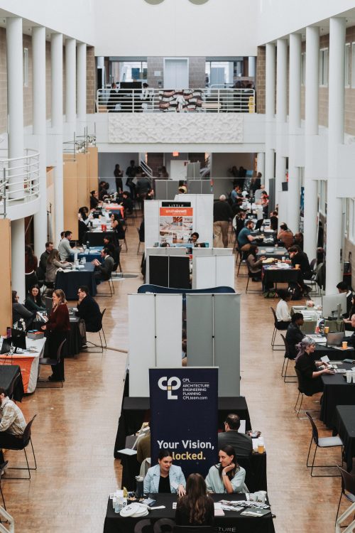 inside of Storrs Hall filled with booths
