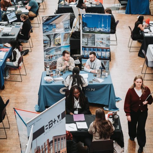 students interviewing at booths