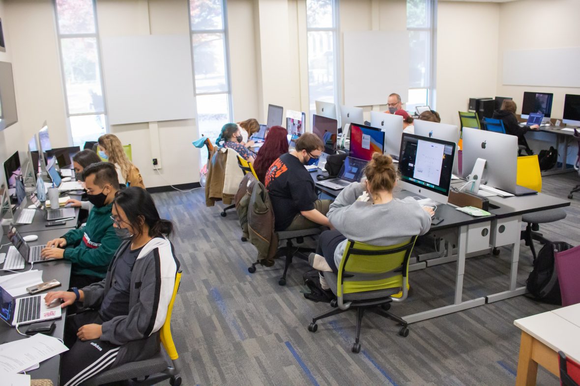 students all seating at computers in a lab