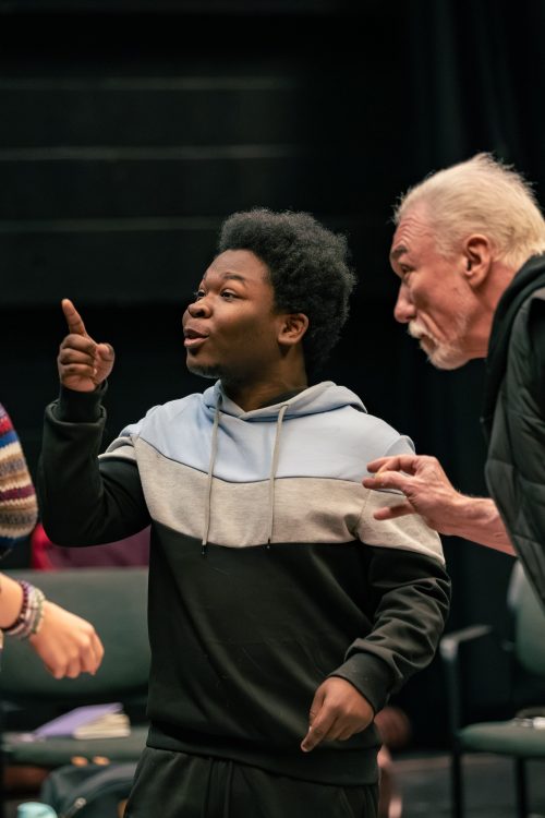 a guest artist coaching two theatre students in a scene