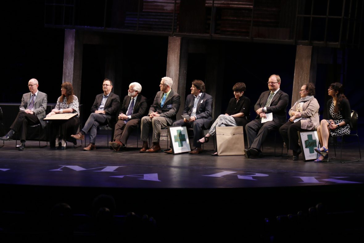 2016 Distinguished Alumni sitting on Belk stage