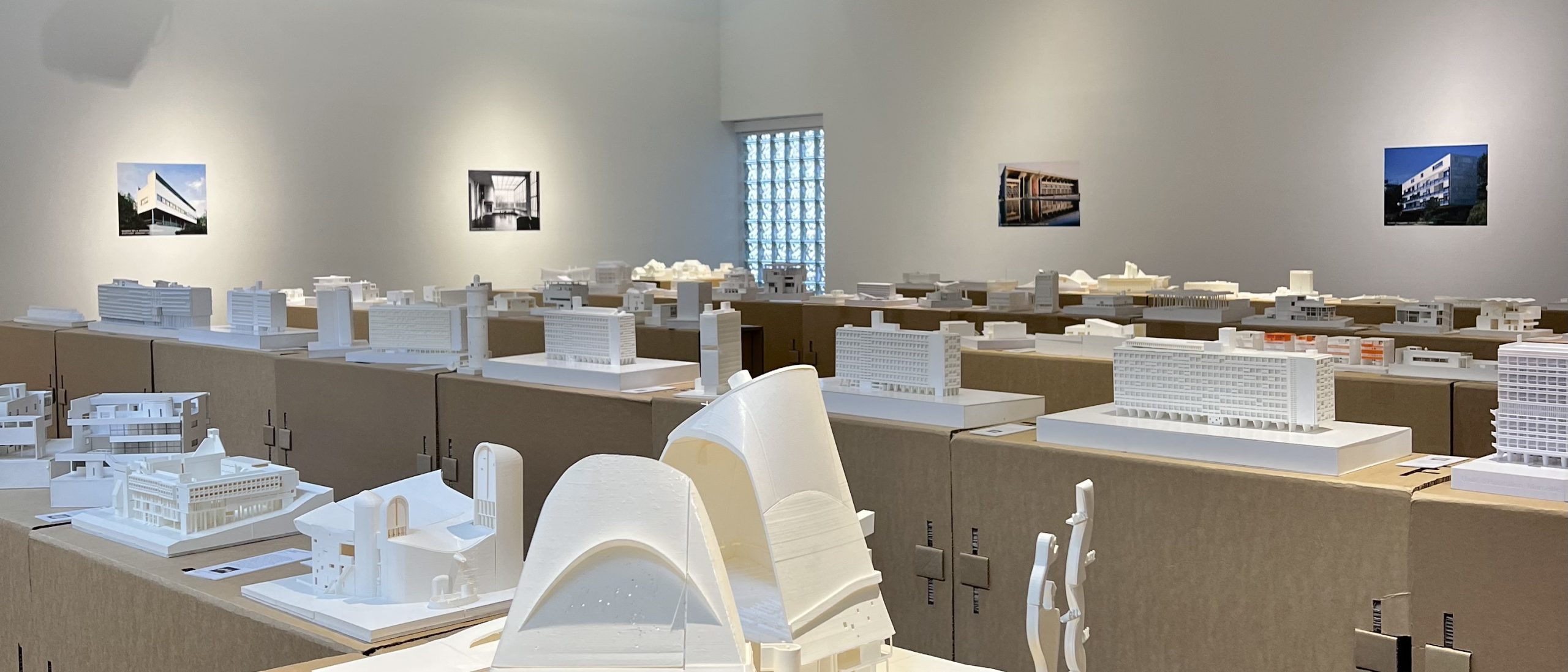 white architectural models displayed in Lambla Gallery