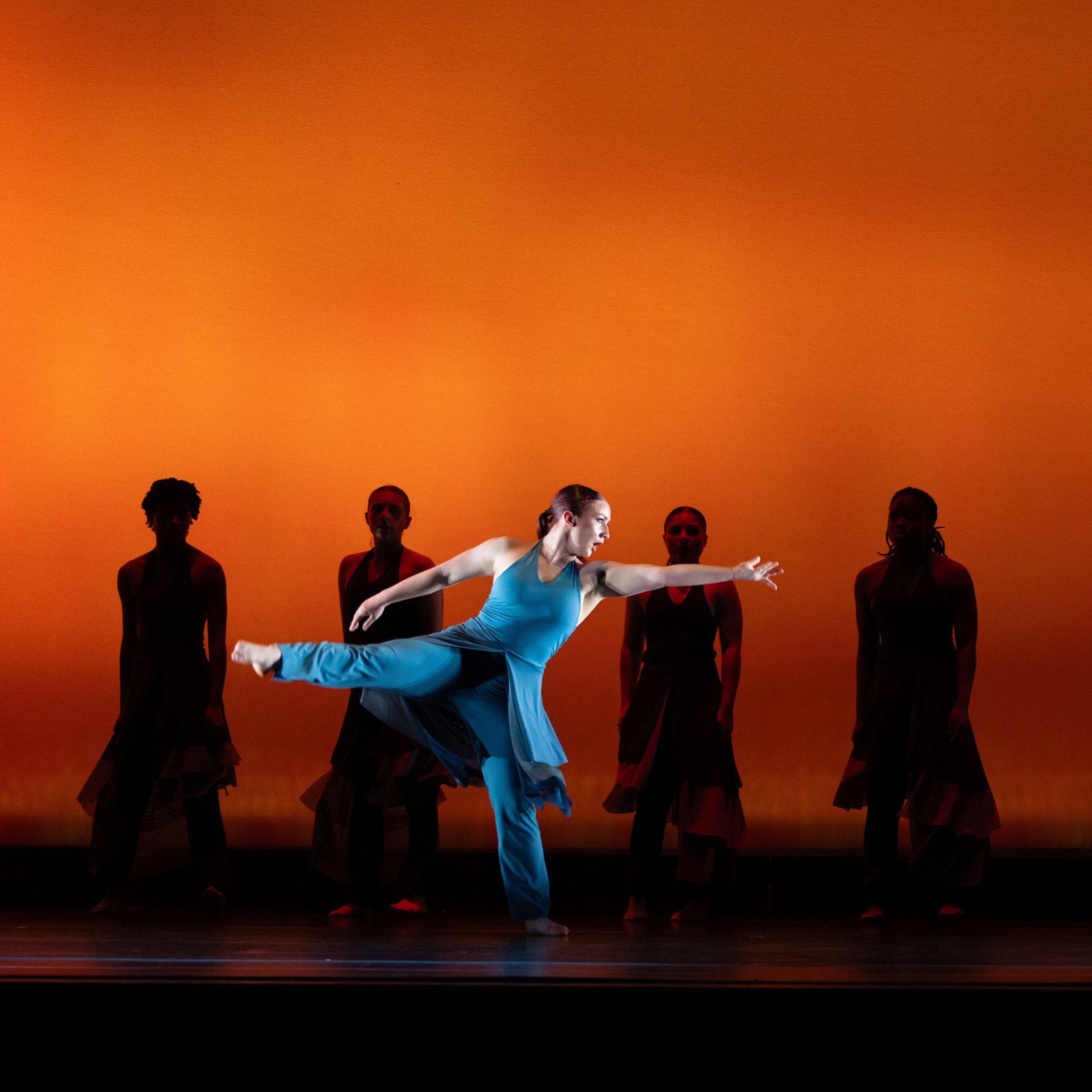 Keegan performing in front of group of dancers