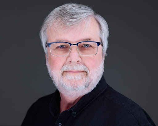 Headshot of Glenn Rawls against a gray background