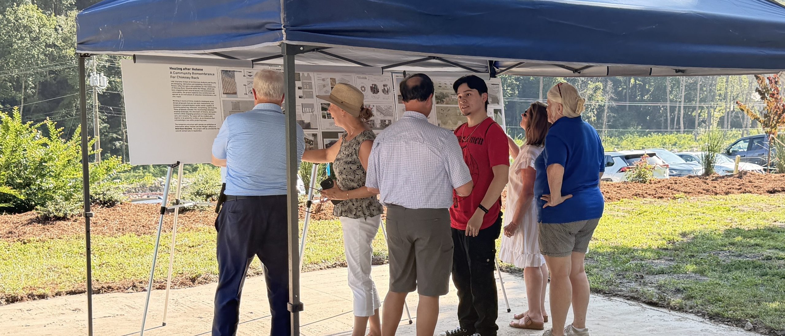 People looking at memorial proposals