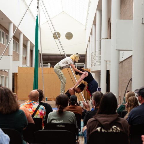 Three students tumbling in the circus showcase