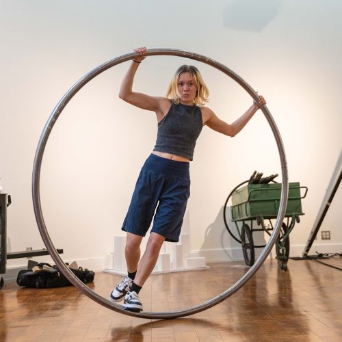 Student standing inside the large circus hoop