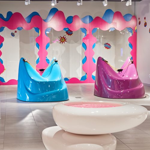 two slime slingshots at Aloomoo Institute, one pink and the other blue
