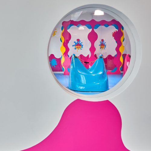 the slime slingshot seen through a circular interior window