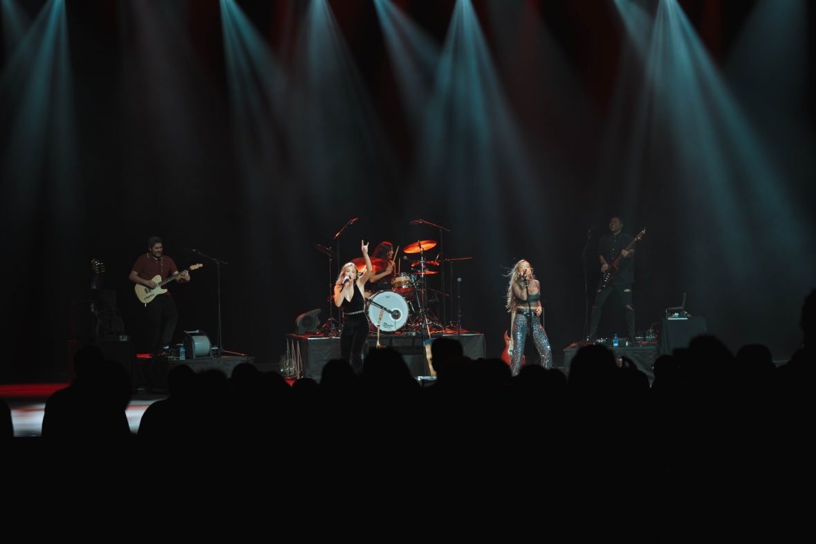 Raven Pfeiffer on drums with Maddie and Tae in concert.