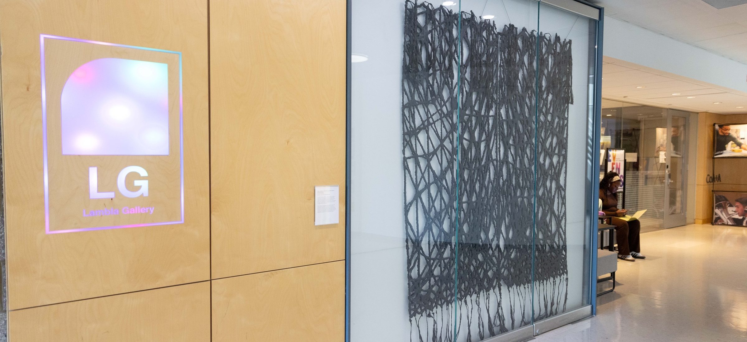 two panels of "Concrete Tapestry" on display in Storrs building lobby.
