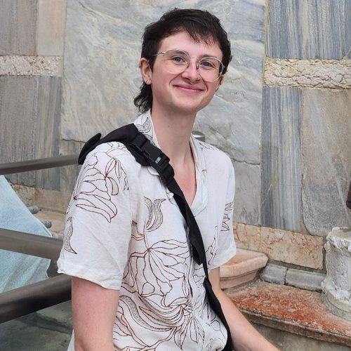 Fin Asher standing in front of building in Italy