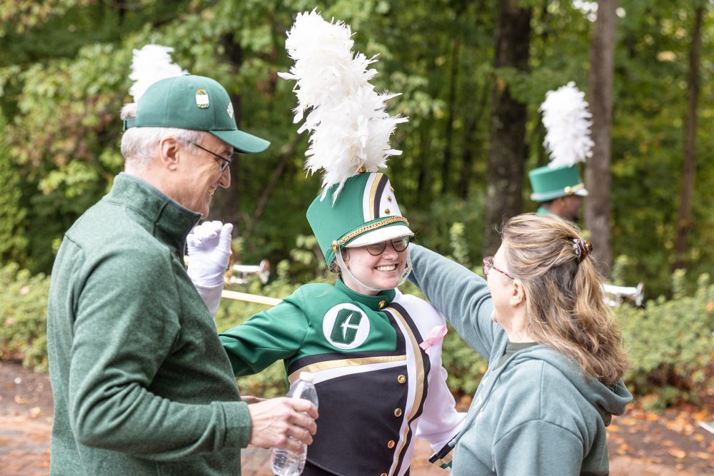 marching band student excited to see her parents after a game