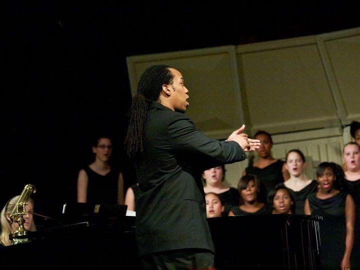 Dungee directing high school chorus