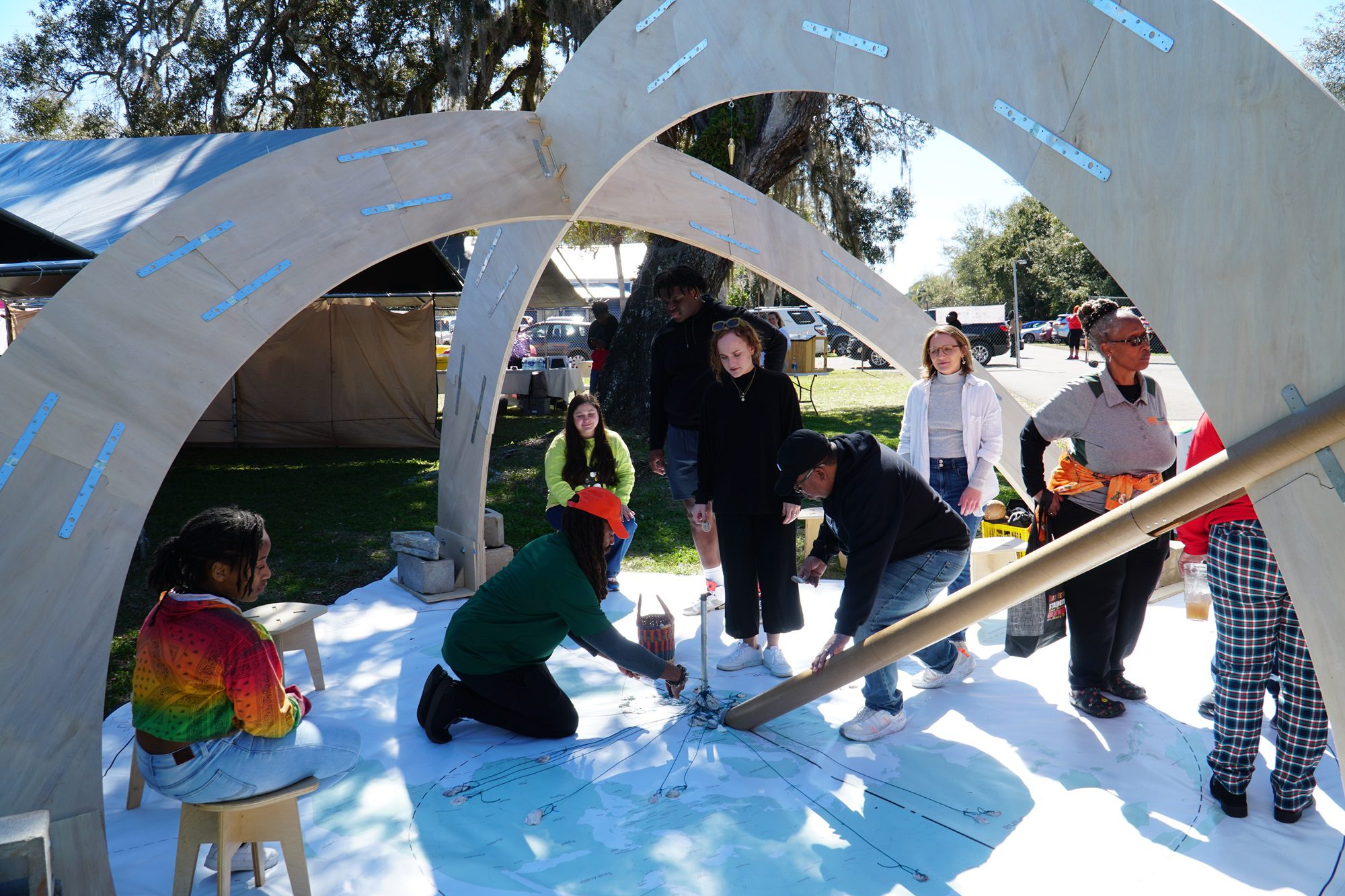 people interacting with the Meridian Dome project