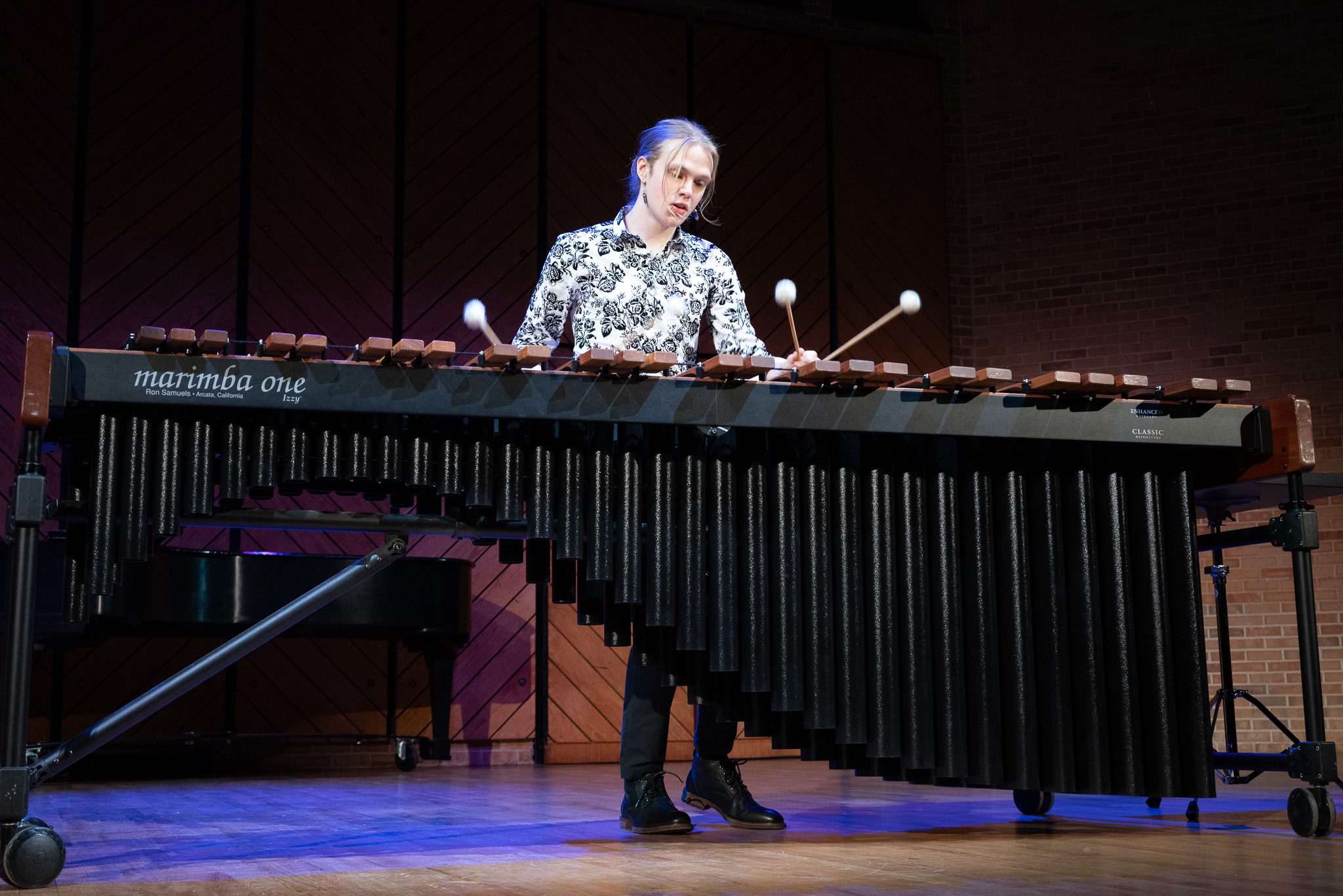 student on stage playing instrument