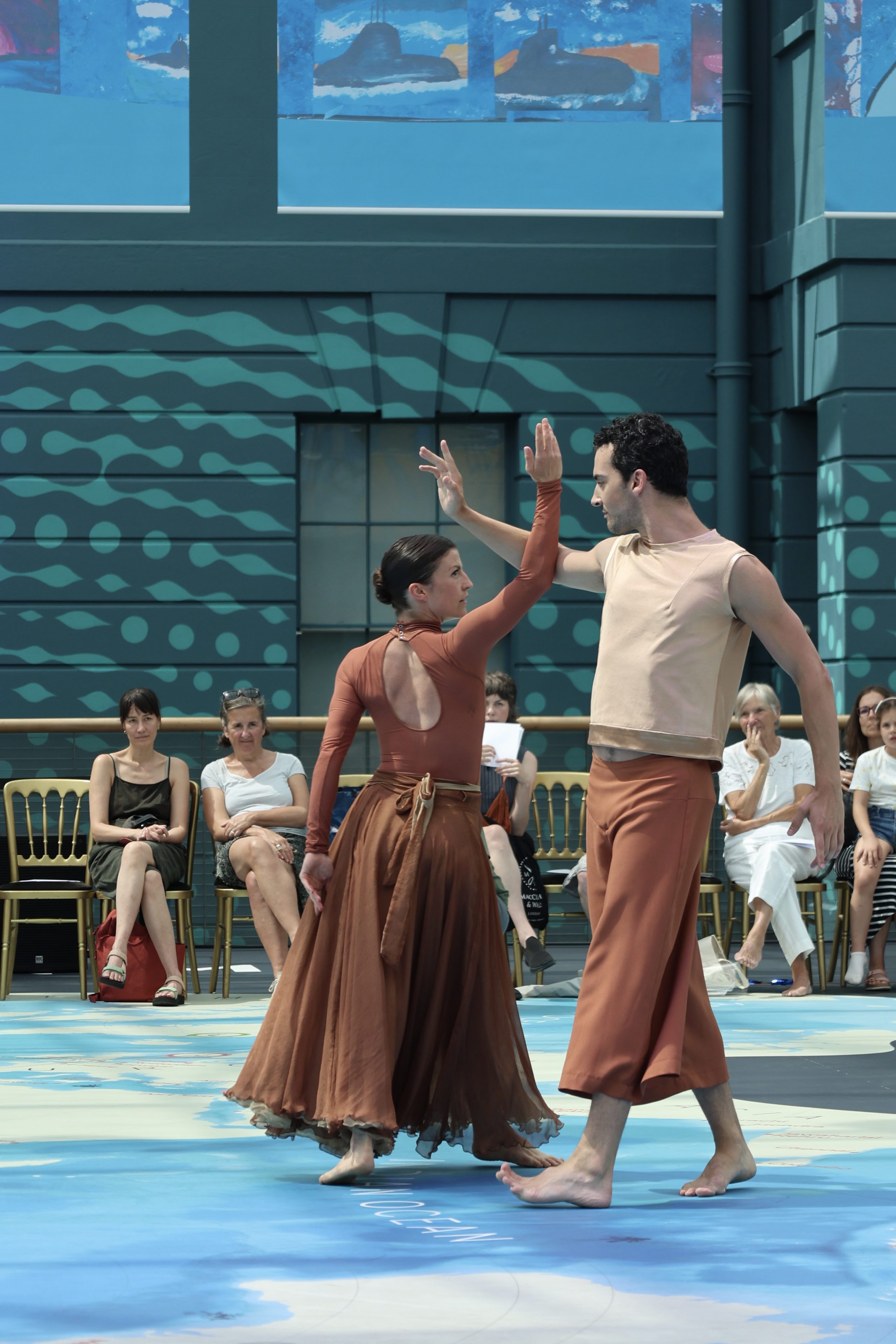 Two dancers performing in the Ocean Court at the Maritime Museum