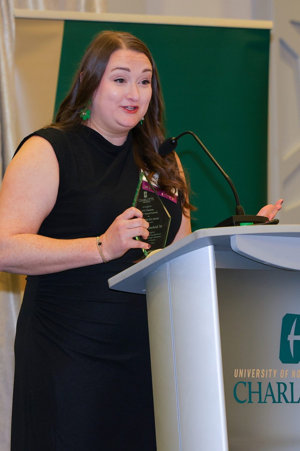 Kaitlyn Linscheid speaking at award ceremony.